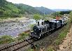 A steam engine pushes along Seomjingang River (Seomjingang Train Village)