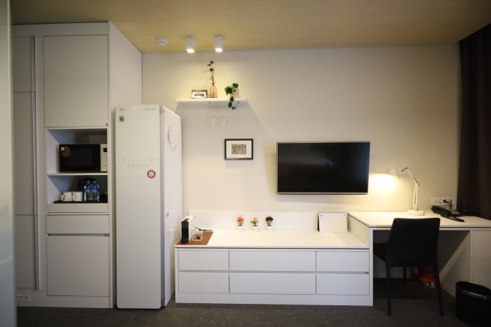 All rooms are equipped with desks, some of which also have a styler