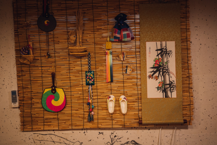 Korean style decorations are hanging on the wall.