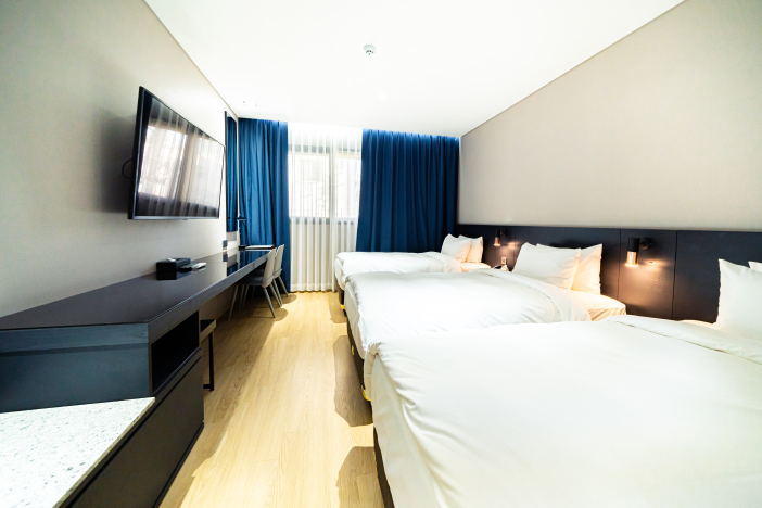 Triple Rooms accommodate three super-single beds.