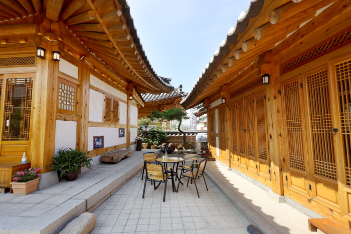 Hanok built of red clay and pine trees with traditional construction techniques applied