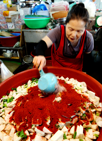Woman making turnip kimchi