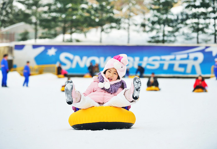 Having fun sledding at Everland 