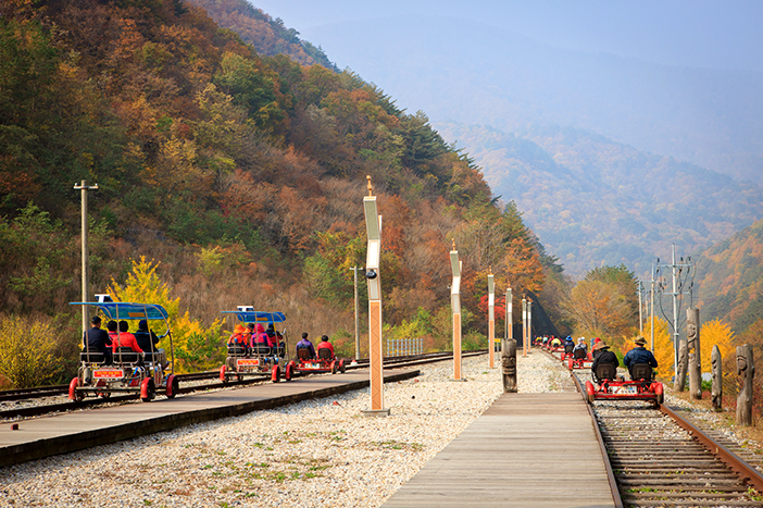 Passing through autumn scenery on Jeongseon Railbike