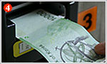 4. The machine will confirm the amount before charging and display the on the second row of the black LCD screen, 