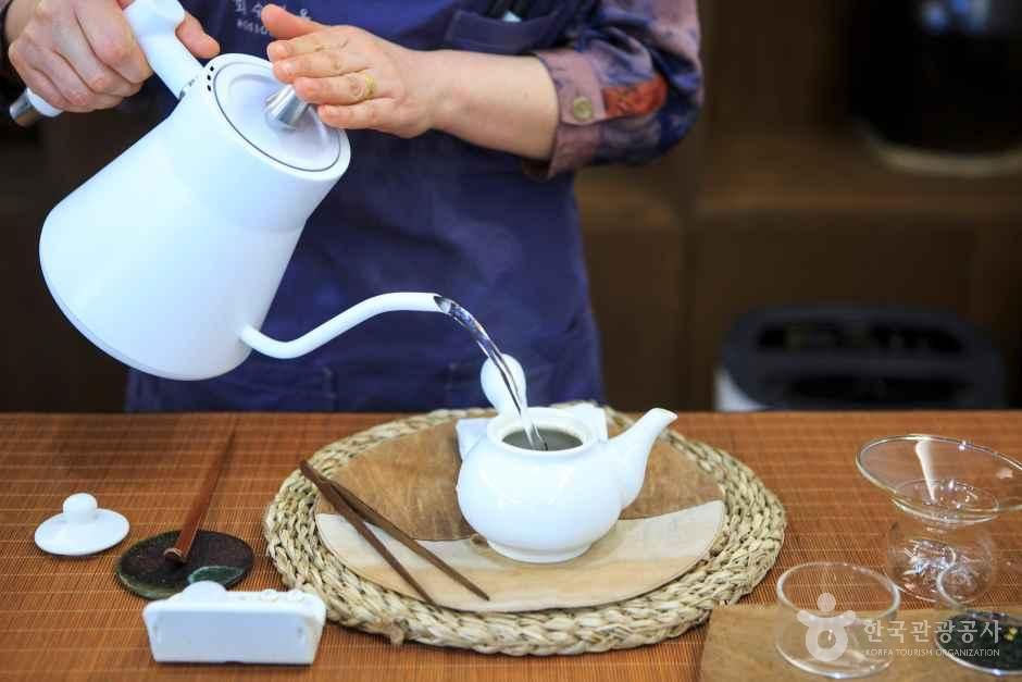 The Tea Master Brewing Tea by Hand