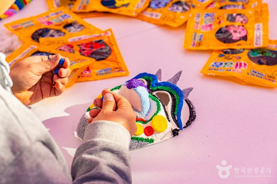 Participant decorating a mask