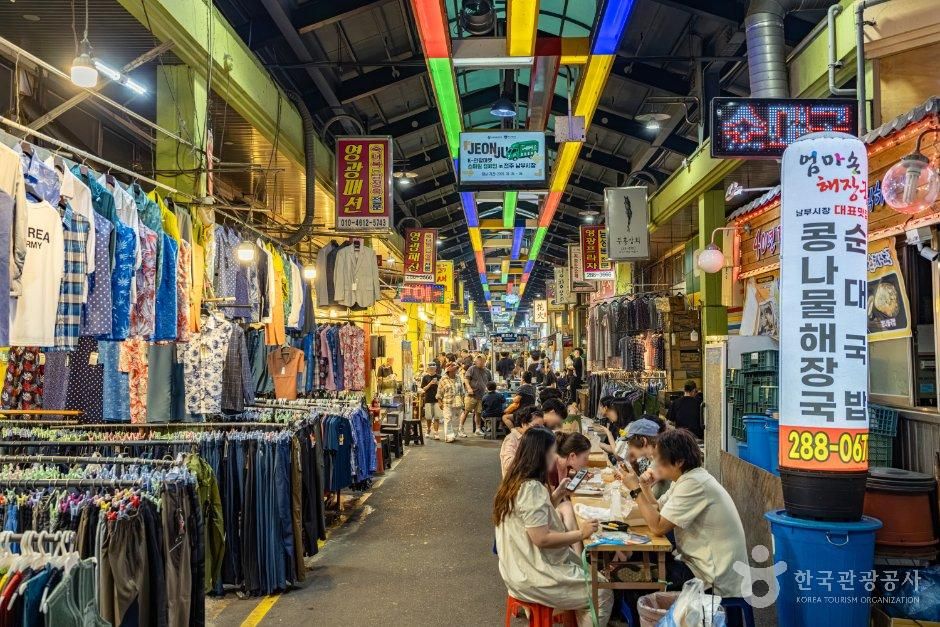 Diners enjoying dinner at tables set up in the street