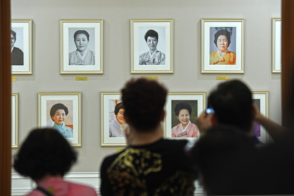 Portraits of all the First Ladies hung up on the wall of Mugunghwa Hall