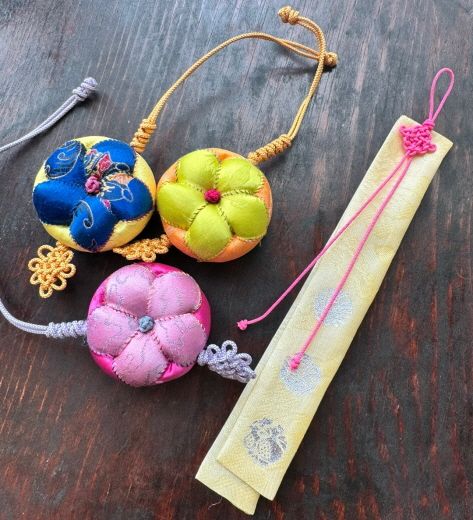 (2) Needlework workshop sample pincushion and bookmarks