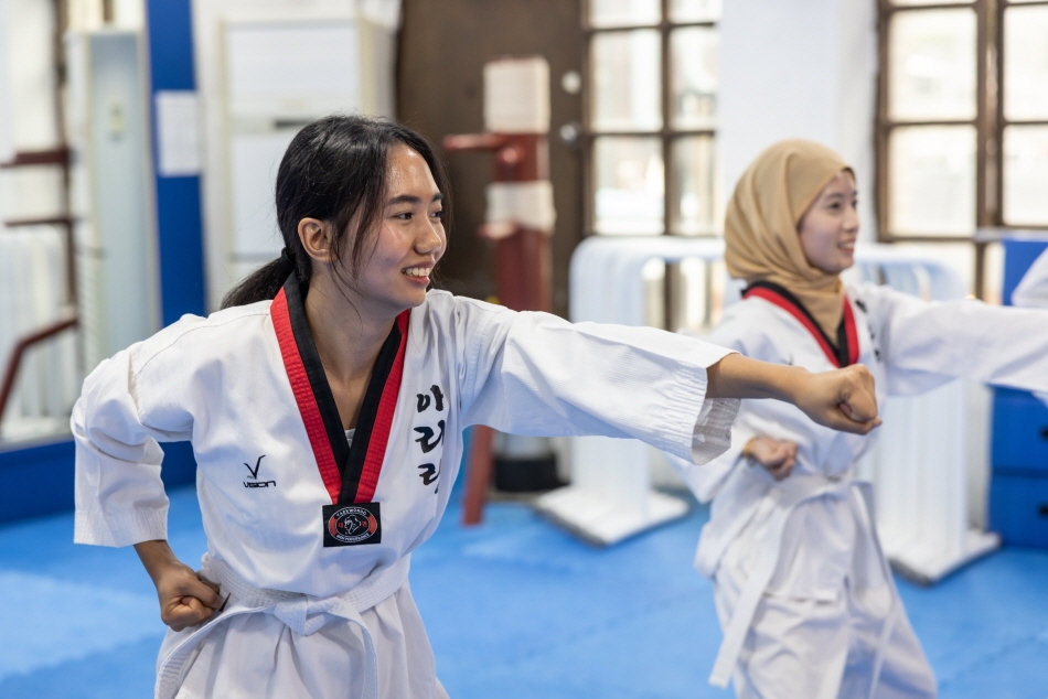 Learning basic taekwondo forms (Credit: Hyphen)