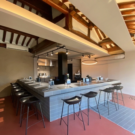 Interior space retains the iconic exposed rafters of hanok buildings 
