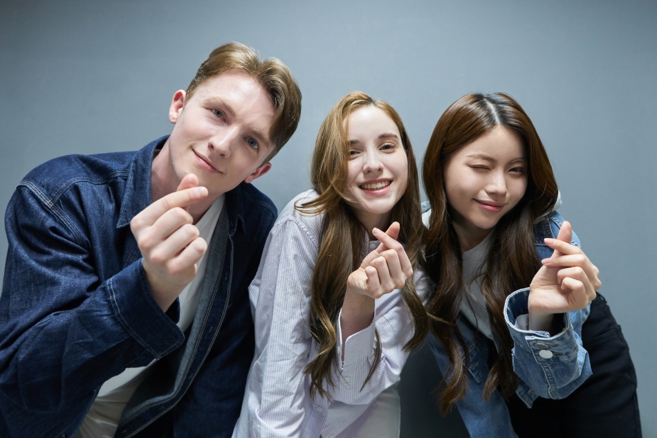Group of friends making finger hearts