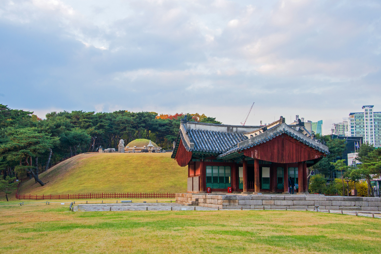 A royal tomb mound and shrine at Seonjeongneung, with the Gangnam skyline behind, Seoul